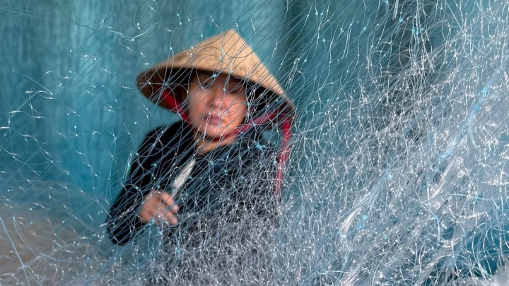 Fishing Net Worker In Hoi An