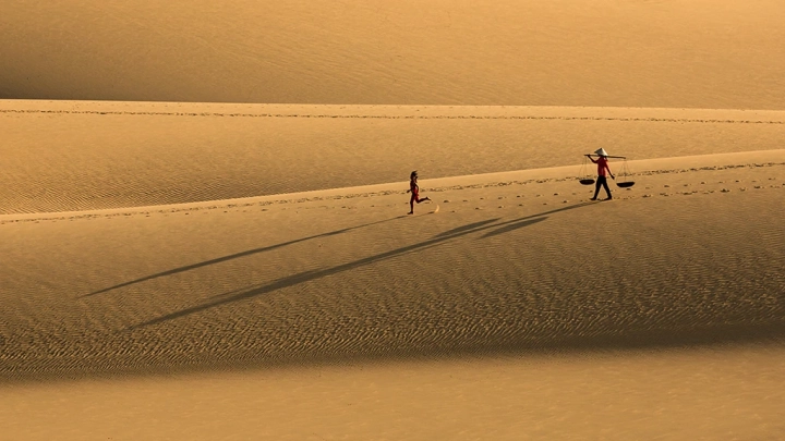 Mother And Daughter On Sanddunes